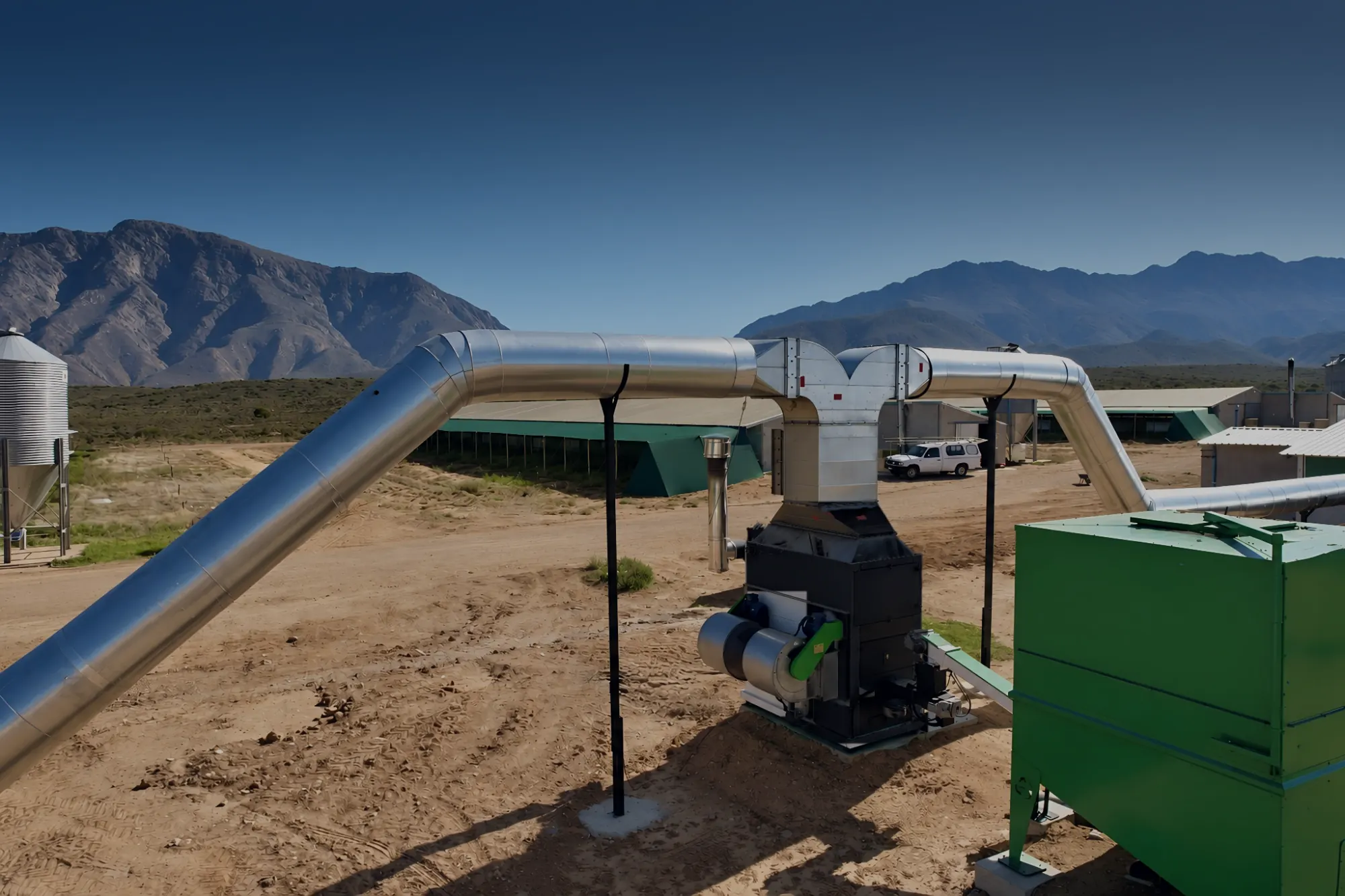 PelleTech AERO outdoors by chicken houses in South Africa, with insulated ducts carrying the warm air into the houses