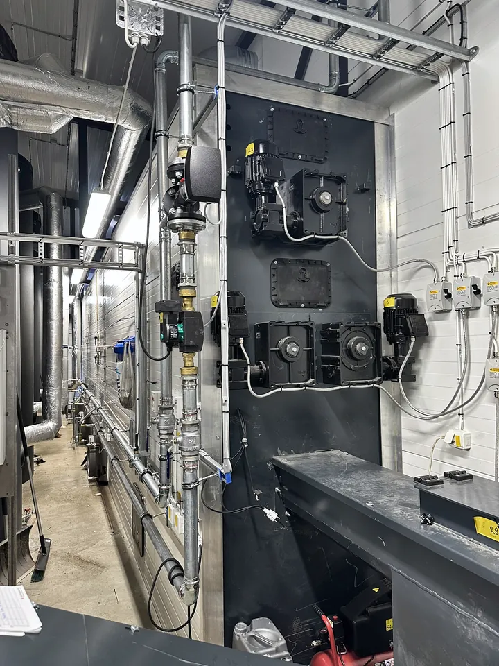 The dryer, with the motors that drive the screws.